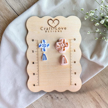 Tile pattern cutter and finished clay earrings displayed on wooden ruler board