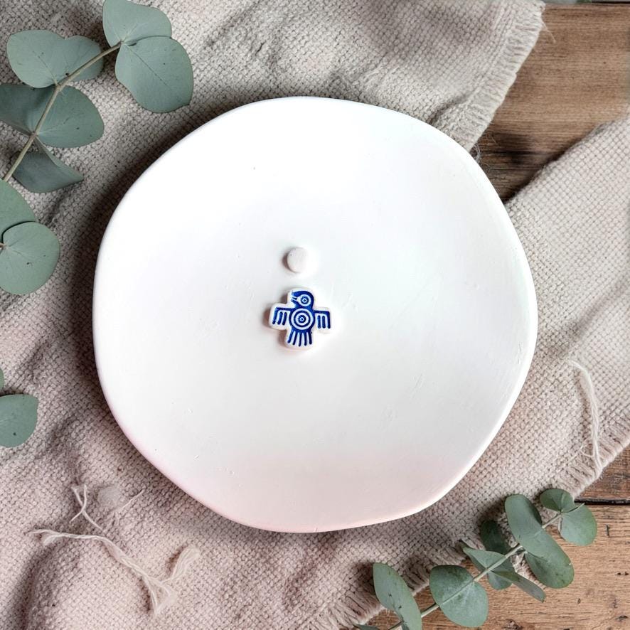 Small blue bird clay earring with tribal line design