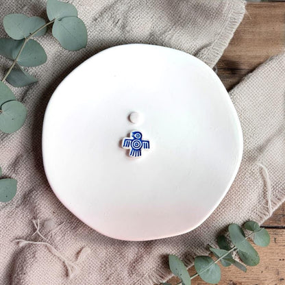 Small blue bird clay earring with tribal line design