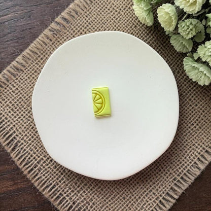 Close up of lemon slice cutter impression in clay