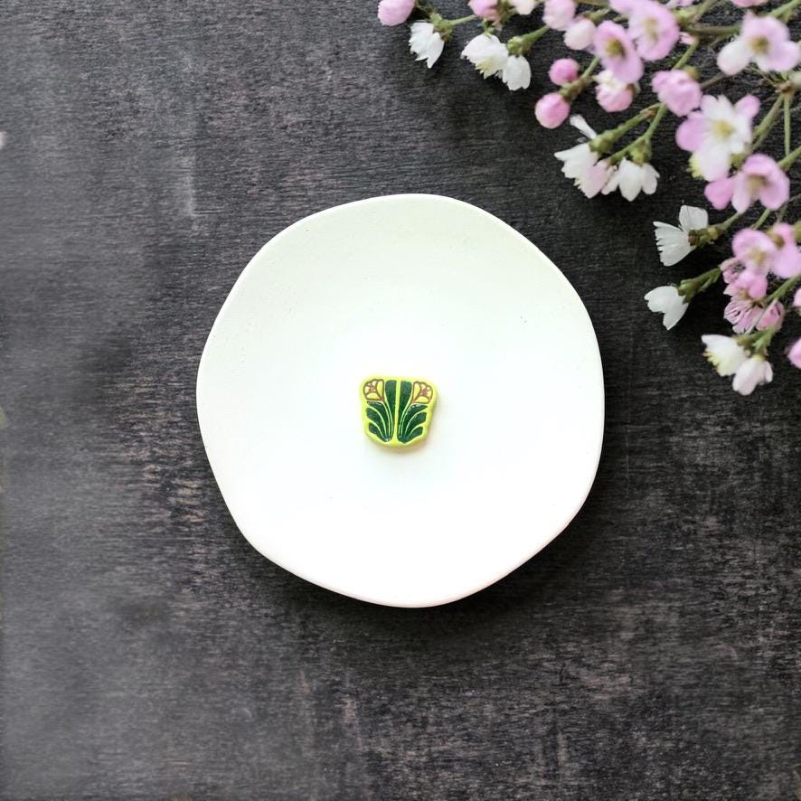 Botanical symmetrical clay cutter on white background