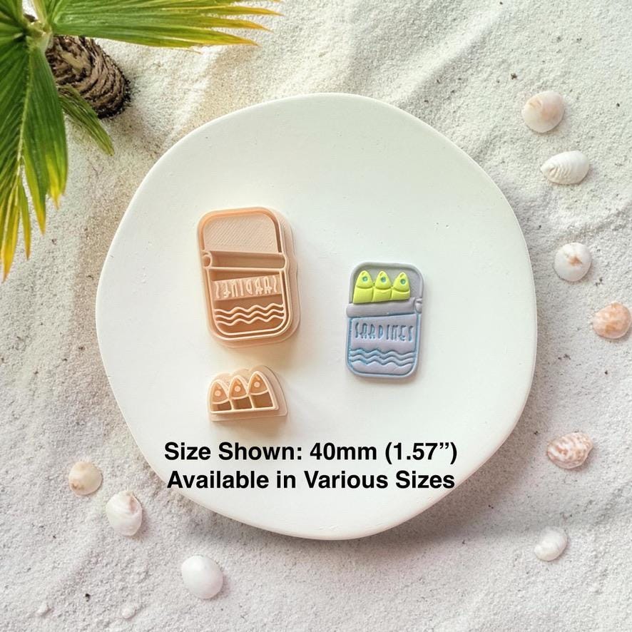 Sardine tin cutter and finished clay piece with size text 40mm displayed on white plate