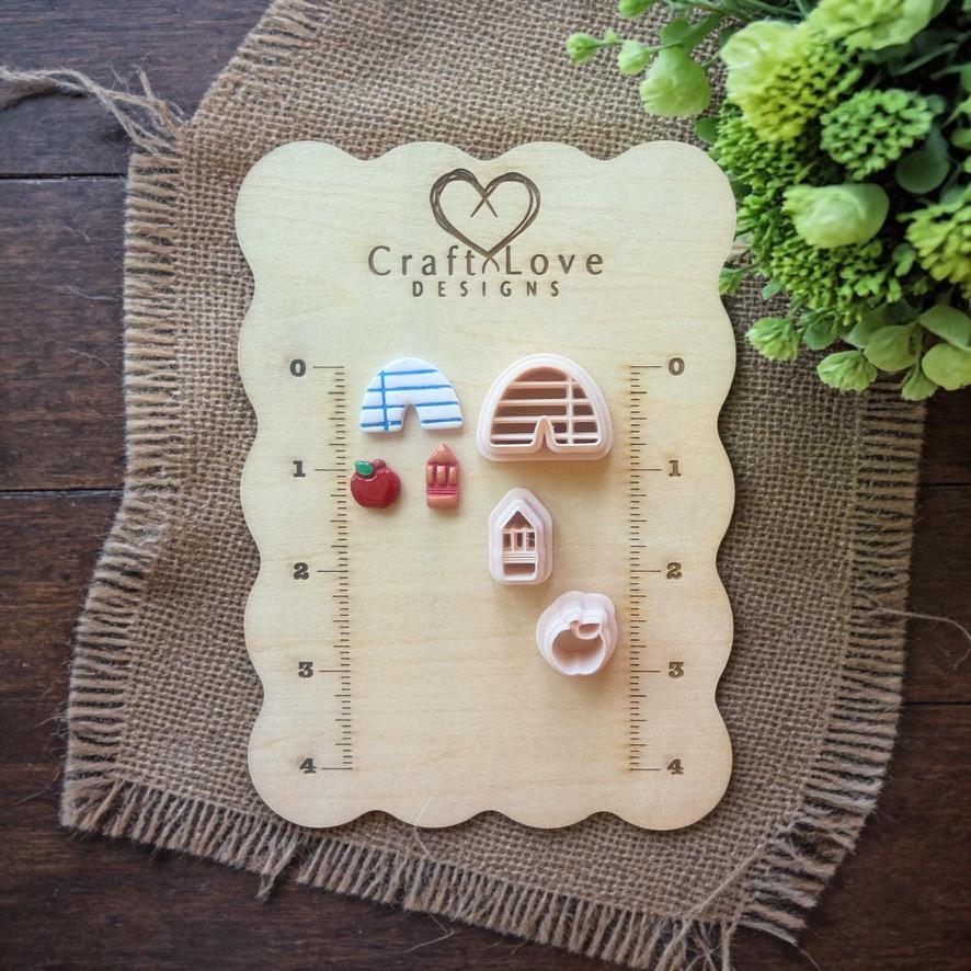 teacher cutter set displayed on wooden ruler board with measurements