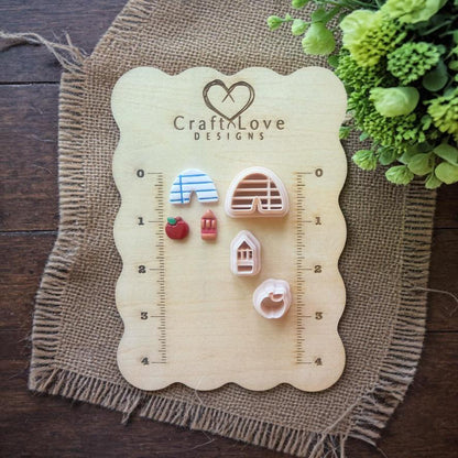 teacher cutter set displayed on wooden ruler board with measurements