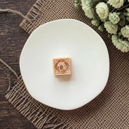 square lemon clay cutter with tile pattern on white plate