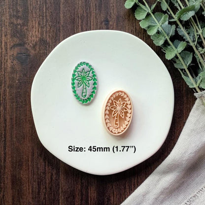 cutter and finished oval palm tree design shown together with size text on plate
