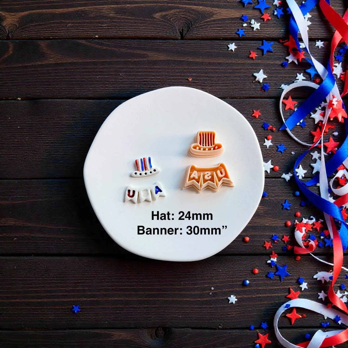 Uncle Sam hat and USA banner polymer clay cutters beside finished clay earrings on a white round surface with patriotic decorations