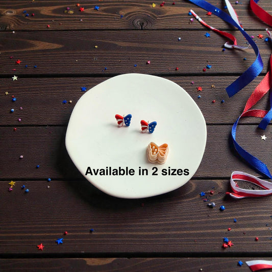 Patriotic butterfly polymer clay cutter with finished earring examples displayed on white surface with text showing available in 2 sizes