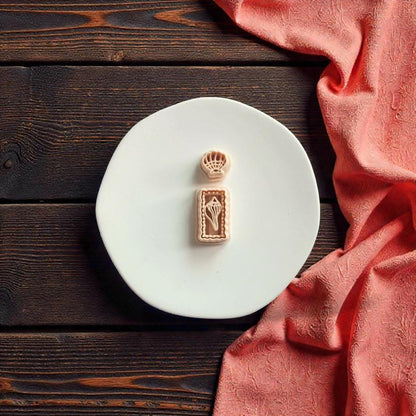 Beach themed polymer clay cutter featuring shell stud and textured rectangle dangle design