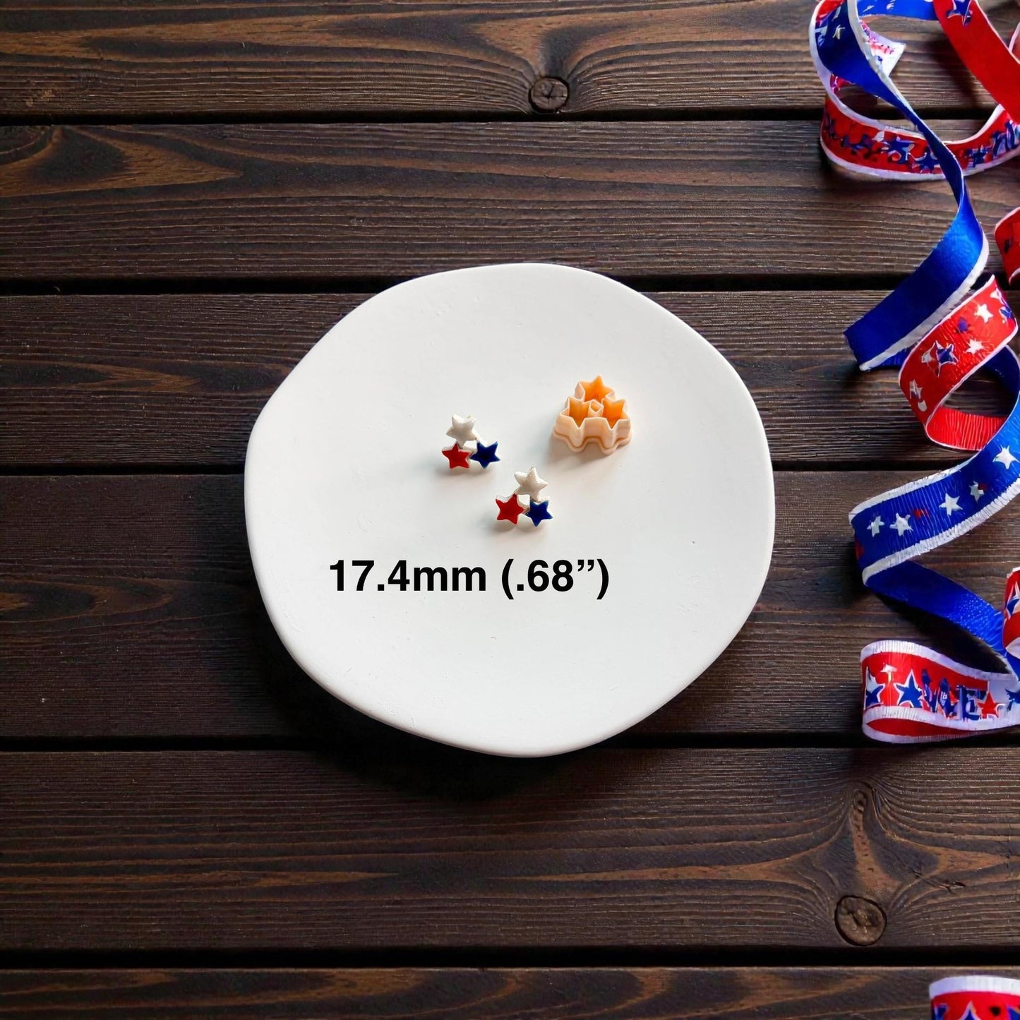 Triple star polymer clay cutter shown beside patriotic stud earrings with 17.4mm size text