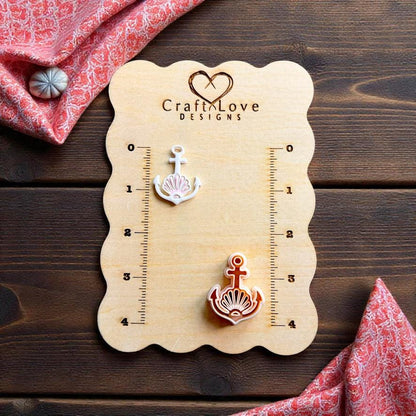Nautical polymer clay cutter with anchor and shell design displayed on CraftLove Designs measurement board