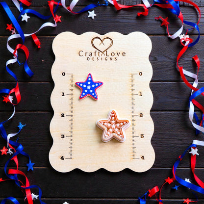Patriotic starfish polymer clay cutter and finished clay piece displayed on CraftLove Designs measurement board with red white and blue ribbon decor