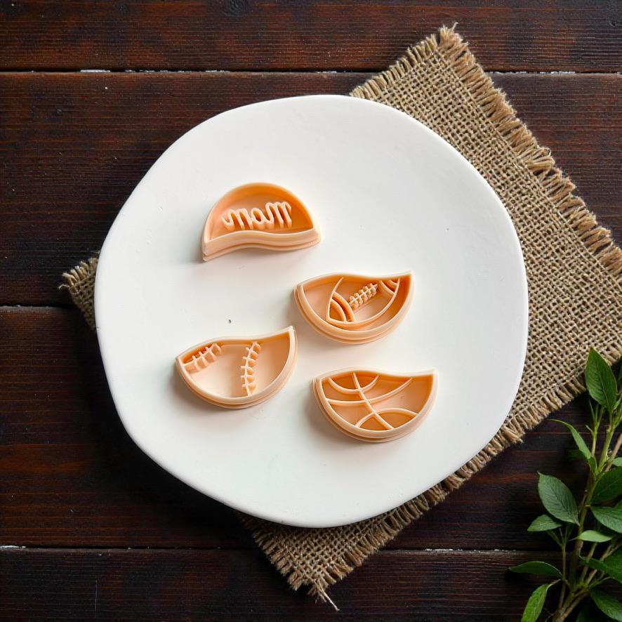 Sports mom polymer clay cutter set featuring interchangeable baseball football and basketball themed bottom pieces