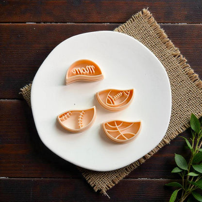 Sports mom polymer clay cutter set featuring interchangeable baseball football and basketball themed bottom pieces