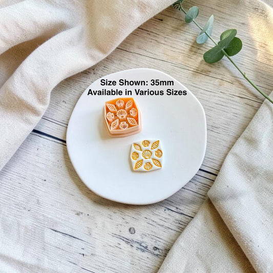 Seashell pattern polymer clay cutter displayed beside the finished earring with text indicating the featured 35mm size and availability in multiple sizes.