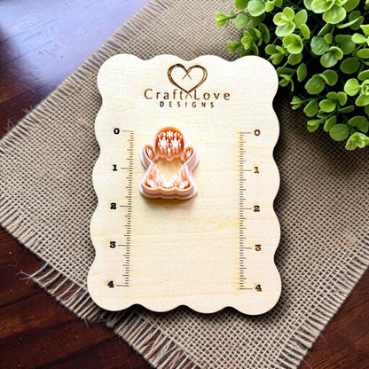 Sugar skull ghost polymer clay cutter displayed on Craft Love Designs measurement board.