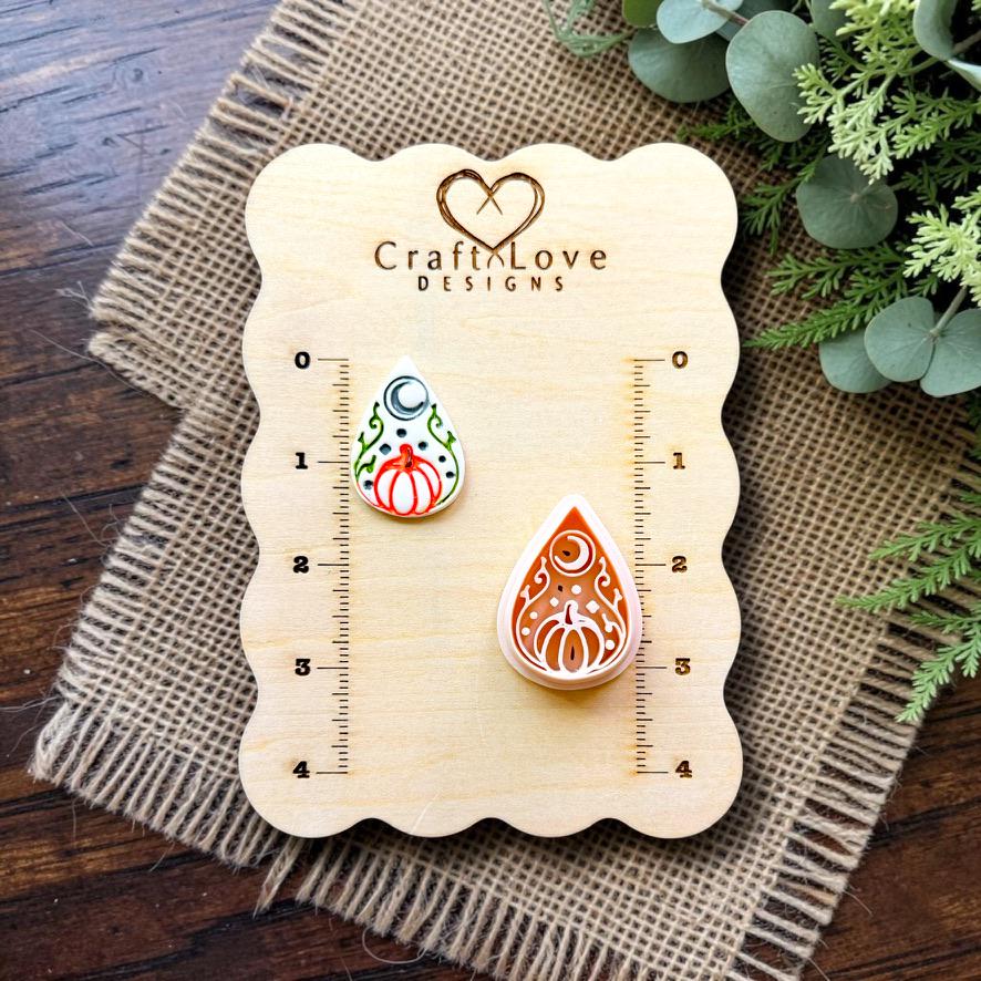Halloween pumpkin teardrop polymer clay cutter with matching embossed sample displayed on the Craft Love Designs measurement board.