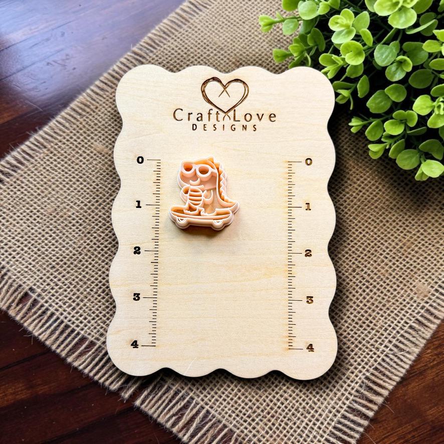 Skateboarding gator polymer clay cutter displayed on a Craft Love Designs measurement board for scale.