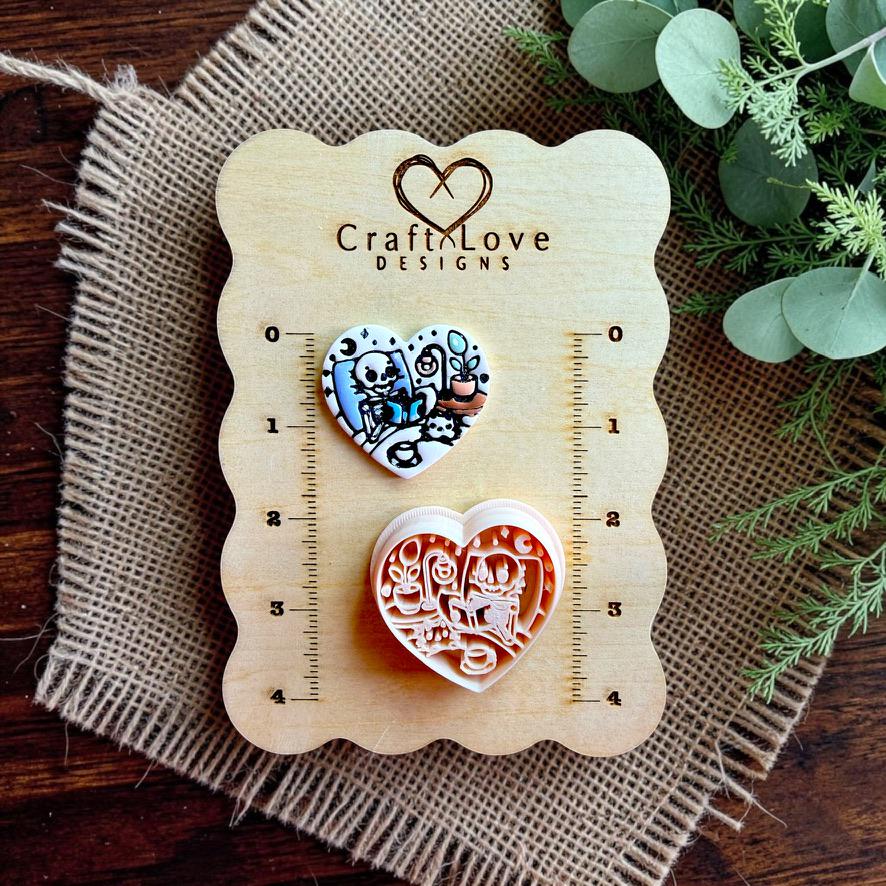 Finished polymer clay heart and matching cutter displayed on a Craft Love Designs sizing board.