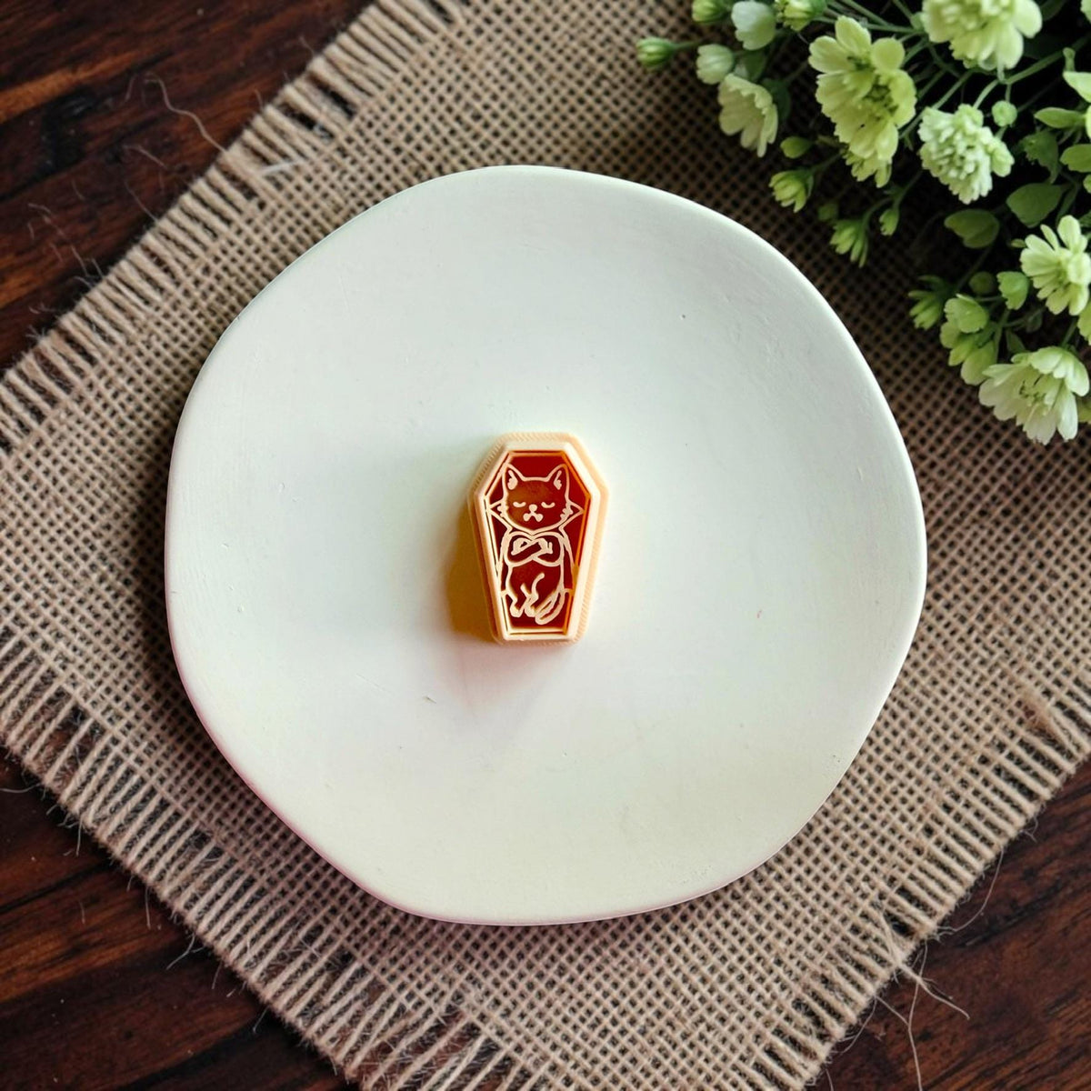 Coffin-shaped polymer clay cutter featuring a cute vampire cat design.