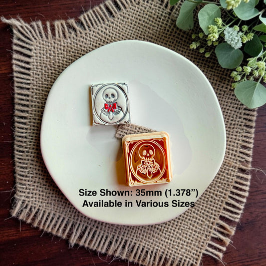 Finished skeleton cameo beside the matching Victorian portrait polymer clay cutter.