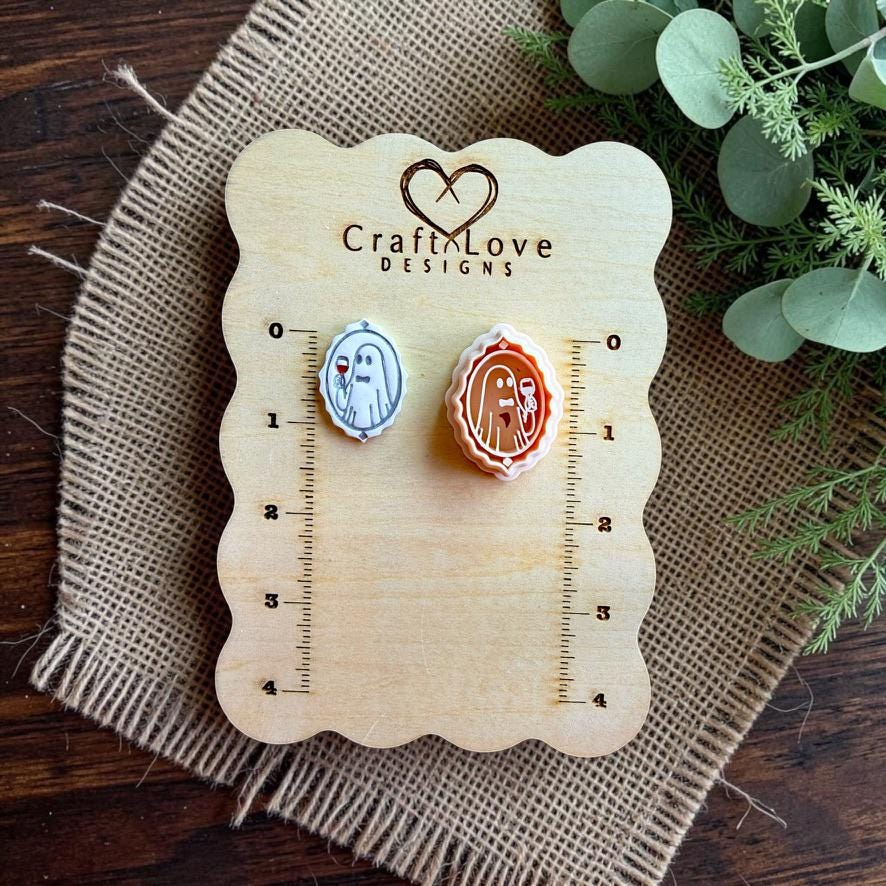 Boozy ghost polymer clay cutter and finished clay piece displayed on a Craft Love Designs sizing board.
