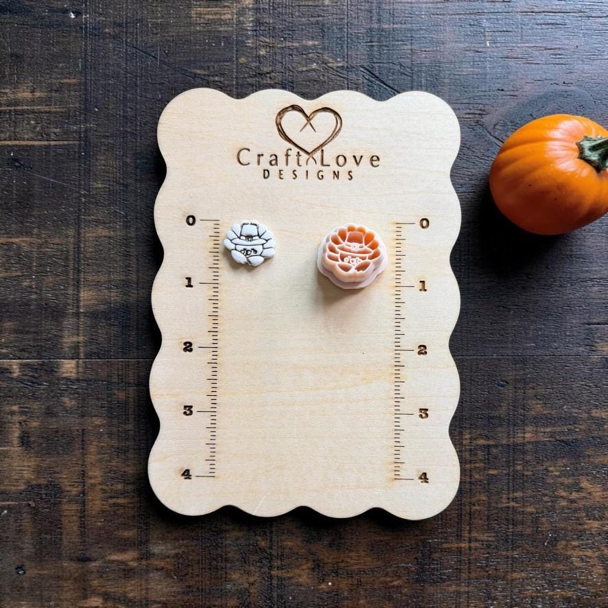 Cute turkey finished clay example and matching polymer clay cutter displayed on a wooden measuring board, showing the turkey's fanned tail feathers and small facial details.