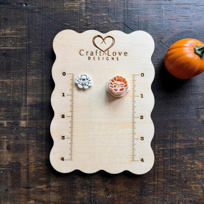 Cute turkey finished clay example and matching polymer clay cutter displayed on a wooden measuring board, showing the turkey's fanned tail feathers and small facial details.
