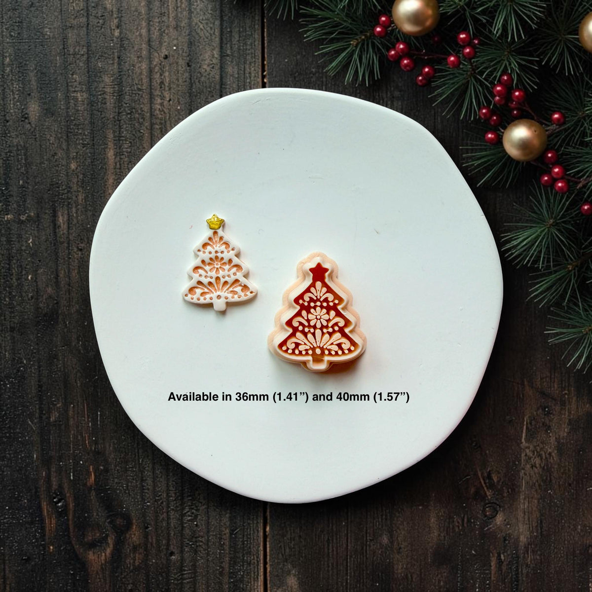 Small white and gold and larger red and cream versions of the decorative Christmas tree design shown together. Text states the design is available in 36mm (1.41") and 40mm (1.57").