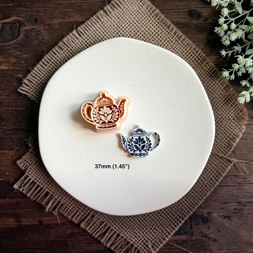 Matching folk teapot cutter and finished clay piece displayed together on a white plate with text showing the size as 37mm.