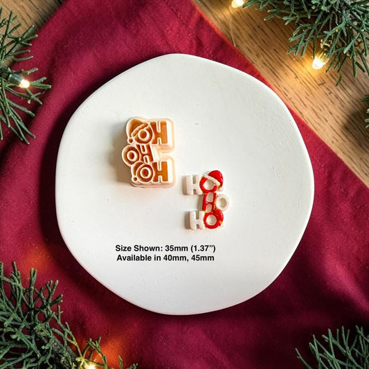 Ho Ho Ho polymer clay cutter beside the finished red and white clay piece on a white plate, with text showing the 35mm size pictured and availability in 40mm and 45mm.