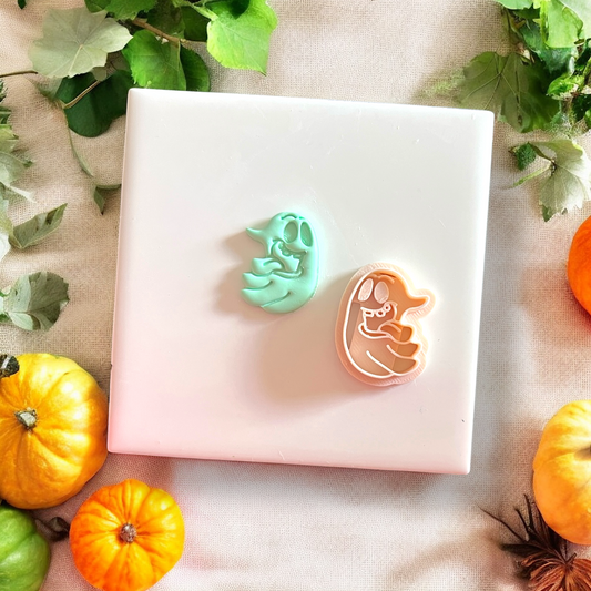 Side-by-side of Silly Ghost clay piece and cutter with festive pumpkins
